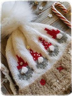 a knitted hat with christmas decorations on it