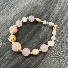 Women Bracelet Made With Pose Quartz, Pearl And Gold Plated Findings. Elegant Adjustable Stretch Bracelet With Natural Stones, Feminine Adjustable Bangle Bracelet, Adjustable Feminine Bangle Bracelet, Handmade Gold Feminine Bracelets, Handmade Feminine Gold Bracelets, Elegant Pink Round Beaded Bracelets, Adjustable Feminine Jewelry With Round Beads, Elegant Pink Single Strand Beaded Bracelets, Elegant Gold Stretch Bracelet With Natural Stones