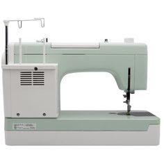 the sewing machine is white and has a light green finish on it's body