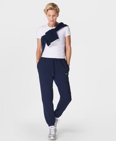 A relaxed new take on our elevated sweatpants. Made from a soft and breathable French terry cotton blend. Loose fit with sporty side panel stitching. Elasticated cuffs and a drawcord at the waist  . Two side pockets. Inseam length: 71.5cm /  28”. Model wears size S and is 178cm/5'10" tall. Style Code: SB9915Colour: Navy Blue Athleisure Joggers With Elastic Cuffs For Workout, Sporty Relaxed Fit Sweatpants With Ribbed Cuffs, Sporty Sweatpants With Ribbed Cuffs And Relaxed Fit, Sporty Joggers With Elastic Cuffs For Sports, Sporty Activewear With Elastic Cuffs For Workout, Athleisure Relaxed Fit Sweatpants With Elastic Panels, Athleisure Joggers For Sports With Straight Hem, Athleisure Sweats With Ribbed Waistband For Jogging, Athleisure Joggers With Elastic Cuffs For Everyday