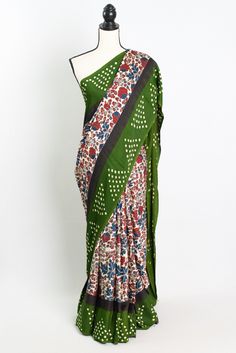 Introducing our stunning Modal Silk Kalamkari Ajrakh Saree with Green Bandhani Border in Off White - a true masterpiece that combines traditional Indian craftsmanship with contemporary elegance. This exquisite saree features intricate Kalamkari and Ajrakh prints in vibrant colors, creating a visually striking design that is sure to turn heads. The green Bandhani border adds a pop of color and traditional charm to this off-white saree, making it perfect for any special occasion or cultural event. Made with high-quality fabric, this saree drapes beautifully and exudes an air of sophistication and grace. Add this timeless piece to your collection and elevate your wardrobe with an authentic Indian touch. Color : Off White and Green. Blouse Piece : Yes. Fall Pico : Yes.  Care: Dry-Clean Only. Bollywood Style Multicolor Block Print Pre-draped Saree, Traditional Multicolor Block Print Pre-draped Saree, Multicolor Block Print Pre-draped Saree For Festivals, Bohemian Multicolor Block Print Pre-draped Saree, Festive Multicolor Block Print Pre-draped Saree, Bohemian Batik Print Saree For Diwali, Traditional Green Pre-draped Saree With Kalamkari Print, Festive Batik Print Saree Traditional Wear, Bohemian Saree With Batik Print