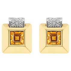 These gorgeous 50's style square earrings feature a 7.3mm vibrant square step cut citrine rubover set in the center. The gemstone is framed in a wide 18 carat yellow gold three-dimensional raised square mount, further designed with a white gold curve addition over the top inlaid with 9 round brilliant cut diamonds totalling to an approximate weight of 0.36ct. The earrings are perfectly finished with a secure French back closure, stamped 750. Square Stud Earrings, 50's Style, Step Cut, Square Earrings Studs, Square Stud, Diamond Gold, Square Earrings, 50s Fashion, Round Brilliant Cut Diamond