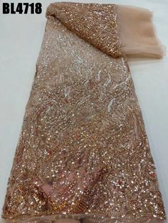 gold sequins and sheer fabric on white background