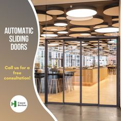 an advertisement for automatic sliding doors in a large room with lots of tables and chairs