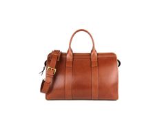 This is a small handmade leather duffle. A great gym bag for the busy executive which would complement one of our briefcases. Leather-lined Duffle Bag Satchel For Everyday Use, Everyday Duffle Bag With Leather Lining, Satchel Shape, Cognac Leather-lined Duffle Bag For Daily Use, Leather Duffle Bag With Zipper For On-the-go, Brown Leather-lined Rectangular Duffle Bag, Travel Duffle, Leather Duffle, Gym Bag, Leather Handmade