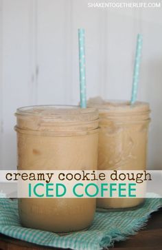 two jars filled with ice cream sitting on top of a table