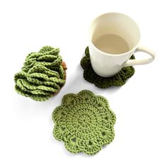 two crocheted coasters and a cup of coffee