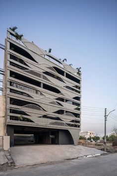 an apartment building with balconies on the roof