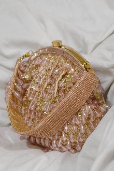 Pink clutch with sequin hand-embroidery and crystal-beaded hangings threaded throughout. Comes with embroidered top handle embellished with crystal tassels.
Type: Embroidered
Composition: Velvet, Faux Suede
Color: Pink
1 main compartment with small stitched pocket inside
Multi-bead tassels
Closure: Kiss lock clasp
Size (cm) approx: 22 x 5 x 18 - Aza Fashions Luxury Bags Collection, Vintage Evening Bags, Velvet Clutch, Embroidered Clutch, Pink Clutch, Suede Bag, Girly Bags, Pink Handbags, Pretty Bags