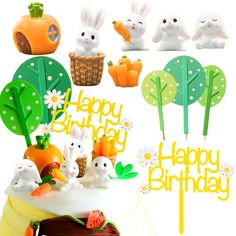 a birthday cake with bunnies and carrots on it