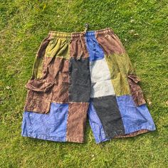 Summer Cargo Shorts | Cotton | Patched | Hippie | Beach | Comfy | Eco Friendly  - Stone washed cotton shorts.  - light and comfy with natural dye colour  - Handmade item  - Perfect wear for summer  - Two side pockets plus one at the back - 100% Organic Cotton - Made in Nepal  Because it's handmade and made by stitching different patches together , the one you will receive might not be 100% identical to the picture . The patch placements might be different and also the symbols   Item no. 1101 Fre Relaxed Fit Patchwork Bottoms For Summer, Casual Festival Shorts, Multicolor Hippie Shorts For Vacation, Hippie Multicolor Shorts For The Beach, Hippie Multicolor Shorts For Beach, Hippie Multicolor Beach Shorts, Casual Patchwork Short Bottoms, Bohemian Green Short Bottoms, Green Festival Bottoms With Built-in Shorts