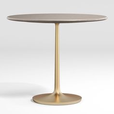 a round table with a gold base on an isolated white background for use in interior and exterior design