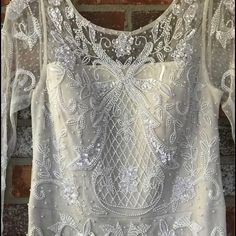 Brand New, Never Worn, Beaded Wedding Dress. Still Has Tags Attached! It’s A Size 4, And Hasn’t Been Altered At All. It Has Been Stored Safely In The Garment Bag From The Dress Shop The Whole Time. I Don’t Have A Need For It Anymore. Price Is Negotiable. Elegant Dresses With Intricate Embroidery For Wedding Reception, Elegant Gown With Intricate Embroidery For Wedding Reception, Sequin Lace Mother Of The Bride Dress For Wedding, Mother Of The Bride Wedding Dress With Intricate Embroidery, White Floor-length Wedding Dress For Mother Of The Bride, Embellished White Wedding Gown, White Embellished Wedding Gown, Embellished White Mother Of The Bride Dress, Wedding Dress With Beaded Fitted Bodice