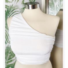 Our Fallen Angel top will have you feeling like a Greek goddess, white color, dress up or down for an endless outfit possibility. Crop top Slim fitting 95% polyester 5% spandex model is wearing a size small Single shoulder Fixed strap Gathered ruched design Pull over design Elasticated waistband Good stretch Double lined Color: white White One-shoulder Stretch Top, White Stretch One-shoulder Top, White Ruched Cropped Top, White Stretch One-shoulder Crop Top, Women Summer Tops, White Stretch Crop Top, Breathable, Angel Top, One Shoulder Shirt, Ruched Crop Top