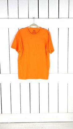 "Jerzees plain solid neon orange cotton tee large Measurements...taken flat -marked size: mens large -chest: 21\" -length: 28\" Condition... -excellent vintage condition -gently worn 13" T Shirt Fanta Orange, Basic Orange Tops For Streetwear, Basic Orange Crew Neck T-shirt, Orange Cotton T-shirt, Basic Orange Cotton T-shirt, Boho Leather, Chevron Print, Neon Orange, Pink Brown