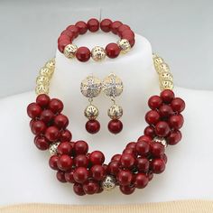 Enhance your bridal look with this classic Nigerian Wedding Bridal Jewelry. The African crystal beads jewelry set adds a touch of elegance and cultural significance to your wedding ensemble, creating a timeless and beautiful look. Round Beaded Jewelry Sets For Wedding, Crystal Jewelry With Gold Beads For Wedding, Pearl Jewelry Sets For Wedding, Elegant Red Bridal Set For Marriage, Beaded Round Jewelry Sets For Wedding, Hand Set Round Beads Jewelry Sets For Wedding, Crystal Necklaces With Polished Beads For Wedding, Elegant Crystal Jewelry With Gold Beads, Beaded Bridal Sets For Wedding