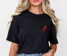 Spice up your style with our 'Hot Pepper' Tee! Featuring a vibrant image of a red chilli pepper and the word 'hot,' this tee adds a fiery touch to any outfit. Crafted with premium materials for comfort and style, it's more than just fashion--it's a statement piece that packs a punch. Whether you're a lover of spicy food or just want to add some heat to your wardrobe, our 'Hot Pepper' Tee is sure to turn up the heat wherever you go. It is made with 100% with ring-spun cotton. The soft-washed, gar Casual Red T-shirt For Gift, Rave Tshirt, Unique Gifts For Women, Stuffed Hot Peppers, Semi Formal, Relaxed Fit, T Shirts For Women, Tops & Tees, Adult Outfits