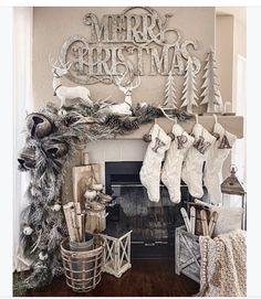 a fireplace decorated for christmas with stockings hanging from the mantel