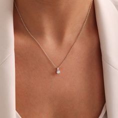 DAINTY - DIAMOND - NECKLACE Elegance meets simplicity with our Dainty Diamond Necklace. This floating diamond solitaire pendant exudes timeless beauty, perfect for weddings, anniversaries, or as a thoughtful gift for her. Delicately crafted to adorn any neckline, it's a versatile piece that adds a touch of sophistication to any occasion. Whether for bridesmaids, brides, or to celebrate Mother's Day, this minimalist necklace is sure to dazzle and delight. Shop now and add a touch of sparkle to yo Bridal Necklace In Diamond White As A Gift, Wedding Silver Clavicle Chain Charm Necklace, Elegant Crystal Necklace With Delicate Chain, Silver Pendant Birthstone Necklace For Wedding, Elegant Diamond White Crystal Necklace As Gift, Elegant Diamond White Crystal Necklace For Gift, Elegant Diamond White Crystal Necklace Gift, Elegant Charm Necklaces For Bridesmaid Gift, Wedding Pendant Birthstone Necklace