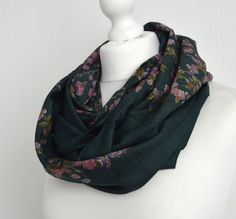 "This stunning eco friendly green and pink floral infinity scarf has been sewn from a vintage silk blend sari's to make a lovely, simple to wear accessory: just wrap it twice or three times around your neck, or fold in half & slip one end through the other - a versatile accessory of generous proportions. The natural, breathable silk means it will keep you warm in the winter but won't be too hot for the summer. The scarf is made from a double layer of fabric which is sewn into a loop with all Green Shawl Scarf For Festive Occasions, Green Shawl Scarves For Festive Occasions, Green Festive Shawl Scarf, Traditional Green Winter Scarf, Festive Green Bohemian Scarves, Traditional Green Scarf As Gift, Traditional Green Scarves As Gift, Floral Sari, Upcycled Christmas