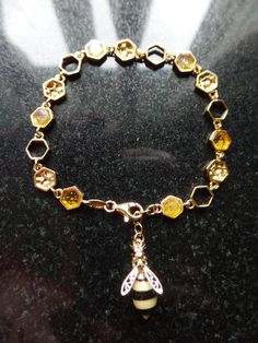 Overseas Buyers, can you please include a Mobile Phone number for the Courier for tracking updates. Gorgeous Gold on Sterling Silver and Baltic Amber Honeycomb and honey Bee Bracelet. Weight is 7.7g Measures 19cm long (7.48 inches) and 0..58cm wide (0.23'') Shipping  will be combined for multiple purchases to reduce costs.  Checkout by 8.30am ensures same day dispatch. Item will be dispatched by Royal Mail 1st Class Recorded Post International Shipping is Tracked Air Mail. Goods based in England Elegant Amber Sterling Silver Bracelets, Honey Bee Bracelet, Elegant Amber Citrine Bracelet, Bee Charm Bracelet, Bee Charm Jewelry, November Birthstone, Wedding Jewelry Bracelets, Baltic Amber, Honey Bee