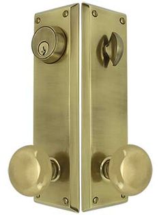 an open door with two knobs and a keyhole on the front, set in satin brass