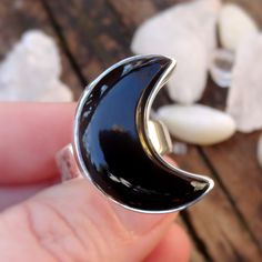 "☾Handmade, Natural Black Onyx Sterling Silver Moon Statement Rings☾ ❤︎Featured in this listing is a sterling silver, handmade, natural stone ring. This lovely ring features a beautiful, Natural Black Onyx Large Moon shaped stone. The Black Onyx Moon has been bezel set into a highly polished, Sterling Silver, sturdy setting. ❤︎Wide gradual band from 4-6mm ❤︎These large 1\" Moons in black onyx have been highly polished, with a rise of 7mm ❤︎Each ring has been hand made, so may vary slightly Stone Mystical Black Sterling Silver Rings, Unique Black Jewelry With Moon Phase, Black Crescent Celestial Jewelry, Unique Black Moon Phase Jewelry, Celestial Black Crescent Jewelry, Celestial Black Sterling Silver Jewelry, Black Sterling Silver Celestial Jewelry, Black Half Moon Jewelry With Moon Phase Detail, Black Half Moon Jewelry With Moon Phase Design