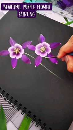 a person is painting flowers on a black sheet with purple paint and the words, beautiful purple flower painting