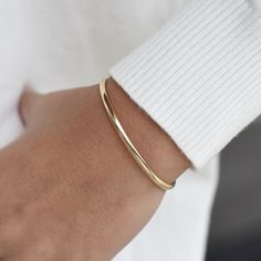 "14K solid gold cuff bracelet The bracelet will be shipped in a gift box * 14K solid gold. It is about 3.25mm width. Please select the size of your wrist.  If your wrist is 6\", please purchase a 6.25\" or 6.5\"bracelet. (If you order a 6\" bracelet, actual cuff length will be 5\" plus 1 inch opening.)" Luxury Adjustable Minimalist Cuff Bracelet, Classic Gold Cuff Bracelet, Classic Gold Open Cuff Bracelet, Everyday Polished Yellow Gold Cuff Bracelet, Gold Minimalist Bangle For Formal Occasions, Classic Yellow Gold Cuff Bracelets, 14k Gold Polished Minimalist Cuff Bracelet, Minimalist 14k Gold Bangle For Everyday Luxury, Elegant Polished Cuff Bracelet For Everyday Wear