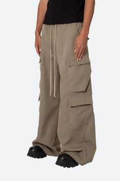 the Rave Double Cargo Pants are designed with a new oversized rave fit, constructed from a polyester fabric with a rinse wash, contrast drawcord, and finished with cargo pockets throughout. details ultra baggy fit throughout 100% polyester extended inseam model is 6’1, 140 lbs and wears a size 30 Rave Fit, Pants Outfit Men, 140 Lbs, Canvas Pants, Cargo Pocket, Loungewear Shorts, Designer Clothes For Men, Denim Flares, Modern Outfits