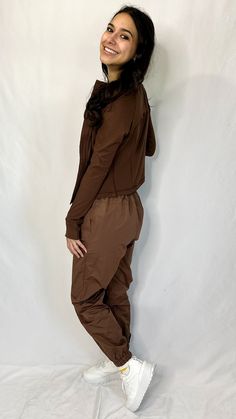 A pair of chocolate joggers with button details on the waist with a tie waistband. Comes with pockets as well. Fit: True to size Small: 2-4 Medium: 6-8 Large: 10-12 The model is wearing a small. Laundry: wash normally Pearl Accessories, Small Laundry, Skirt Jumpsuit, Kids Outerwear, Knit Sweatshirt, The Model, Sweatshirt Dress, Personal Shopping, Outerwear Women