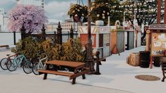 there are many different benches and tables in the city street with bicycles parked next to them