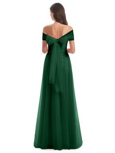 a woman in a long green dress with a bow at the waist and back view