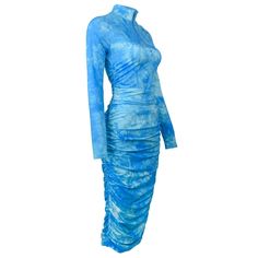 This Blue Tie Dye Ruched Midi Dress exudes a classy and elegant vibe, perfect for any occasion. The ruched detailing adds a touch of sophistication, while the midi length provides a flattering silhouette. Make a statement with this chic dress. Elasticity: Medium Stretch Neckline: Turtleneck Tie Dye Dresses Length: Mid-Calf Material: Polyester, Spandex Closure Type: zipper Sleeve Length(cm): Full Size: Extra-Small, Small, Medium, Large, Extra-Large Color: Sky Blue Blue Ruched Maxi Dress, Blue Midi Dress With Ruched Bodice For Formal Occasions, Formal Blue Midi Dress With Ruched Bodice, Blue Long Sleeve Ruched Dress, Ruched Bodycon Midi Maxi Dress, Blue Fitted Asymmetrical Midi Dress, Blue Dresses With Ruched Sides For Evening, Fitted Blue Dress With Ruched Sides, Blue Evening Dresses With Ruched Sides