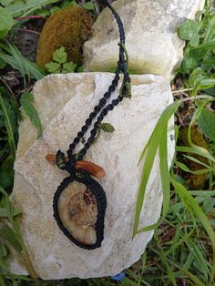 Hi loves  This is a powerful and unique handmade necklace with a beautiful rare large citrine in ammonite stone and a piece of oak wood  a crystal is a living being who, like you, has come to continue its process of ascension. Minerals are unique and rare, precious and full of wisdom. They can teach us great things. They deserve our respect and attentive care. Ammonite is very connected to Mother Earth, even if it conveys the wisdom and power of the 4 elements. It possesses a rare wisdom and kno Amulet Style Macrame Pendant Necklace, Macrame Amulet Pendant Necklace, Macrame Pendant Amulet Necklace, Spiritual Macrame Pendant Necklace, Handmade Spiritual Necklaces In Natural Color, Handmade Spiritual Necklaces With Natural Look, Handmade Natural Spiritual Necklace, Natural Handmade Spiritual Necklace, Artisan Macrame Necklaces For Healing