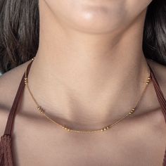 our Wildest Dreams Necklace is designed for effortless daily wear, making it a must-have for your jewelry essentials. its delicate and versatile design allows for easy layering. a dainty and versatile layering piece that will add an understated touch to any look. 18k gold pvd over 316 stainless steel water resistant 2mm beads 16.5" long with 2" extender ideal for layering Everyday Hypoallergenic Yellow Gold Necklace, Minimalist Tiny Beaded Necklaces For Layering, Minimalist Tiny Beads Chain Necklace For Everyday, Dainty Station Necklace With Adjustable Chain For Everyday, Delicate Station Necklace For Everyday Wear, Everyday Delicate Station Necklace With Delicate Chain, Delicate Station Necklace For Everyday, Delicate Station Necklace With Satellite Chain, Dainty Gold Hypoallergenic Necklace