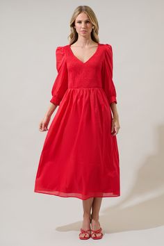 The Zelda Smocked Long Sleeve Midi Dress is a perfect piece to transition seasons and look fantastic! Long sleeves with smocked cuffs frame a smocked bodice with a v-neckline. The bottom skirt creates pleats and a flowy fit. Add on gold jewelry and matching heels or loafers. - Smocked bodice- V-neck- Puffed long sleeves- Pockets- Comes in 3 colorsSize + Fit - Model is 5'10" and wearing size XS- Measurements taken from size S - Chest: 14"- Length: 49" Fabric Self: 100% Cotton, Lining: 97% Polyest Spring Billowy Ruched Smocked Dress, Elegant V-neck Smocked Dress With Smocked Cuffs, Fall Knee-length Smocked Dress With Smocked Cuffs, Solid Color Smocked Bodice Puff Sleeve Dress, Solid Smocked Bodice Puff Sleeve Dress, Smocked Bodice Puff Sleeve Dress, Puff Sleeve Smock Midi Dress For Brunch, Solid Smocked Bodice Dress With Puff Sleeves, Fall Smocked Bodice Knee-length Dress