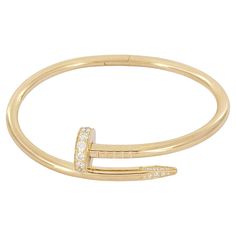 Brand Cartier Style Nail Material 18K Yellow Gold with Diamonds Brilliant cut Diamonds totaling 0.58ct Diamond estimated quality: EF/VS Bracelet Size 17 Bracelet Weight 31.5gr Bracelet width 3.5mm Mint Condition Like, new Comes with Cartier Bracelet Box Cartier Gold Diamond Bracelets, Luxury Gold Cartier Diamond Bracelet, Luxury Cartier Gold Bracelet With 17 Jewels, Red Heels Cartier Bracelet, Luxury Elegant Cartier Bracelet, Elegant Cartier Yellow Gold Bracelet, Cartier Designer Yellow Gold Jewelry, Luxury Cartier Yellow Gold Bracelet, Cartier Nail Bracelet