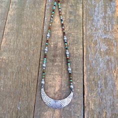 Adjustable Silver Bohemian Beaded Necklace, Bohemian Beaded Crescent Jewelry, Bohemian Crescent Beaded Jewelry, Bohemian Metal Beaded Necklaces With Colorful Beads, Bohemian Beaded Necklaces With Colorful Metal Beads, Bohemian Metal Beaded Necklace With Colorful Beads, Bohemian Jewelry With Spacer And Metal Beads, Bohemian Metal Spacer Beads Jewelry, Bohemian Crescent Metal Necklaces