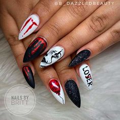 the nails are decorated with black, white and red nail polishes that read i love you