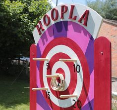 a red and purple target with the word koopia on it's side