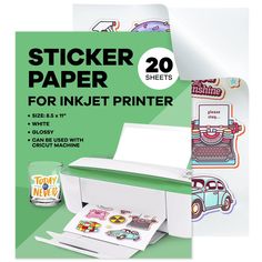 a white printer sitting on top of a table next to a roll of stickers