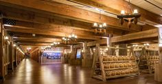 the inside of a building with wooden floors and walls