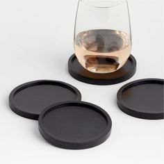 Our simply designed Tondo coasters put the beauty of natural wood in plain sight. Each of the four handcarved coasters in the set exhibits its own unique grain pattern enhanced with a black finish. Raised edges keep drinks secure and prevent leaking of condensation onto table surfaces. For a beautifully coordinated table or bar, pair the wood coasters with the other pieces in our Tondo serving collection.By choosing FSCr-certified products, you are supporting responsible management of the world' Man Kitchen Decor, Coaster Design Ideas, Black Couch, Ebonized Wood, Black Coasters, Modern Coasters, Rustic Coasters, Apartment Aesthetic, Bar Tools