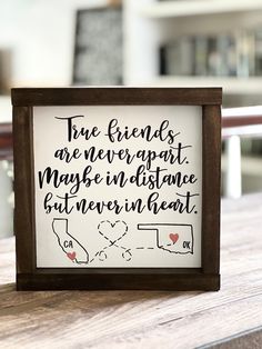 a wooden frame holding a sign that says, true friends are never apart maybe in distance but between heart