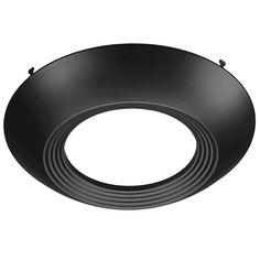 a black circular light fixture on a white background, with the bottom section facing upward