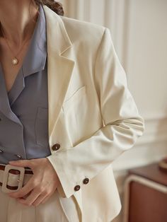 Color
White


Detail
Lapel collar; Lined with pockets; Natural wooden buttons


Composition
69% Polyester, 29% Viscose, 2% Spandex



Washing Method

Hand wash in cool water, using a mild and gentle detergent.