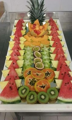 a table topped with lots of cut up fruits and veggies on top of it