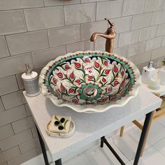 a bathroom sink sitting on top of a counter