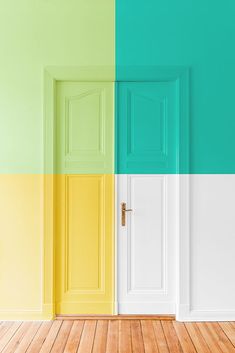 an empty room with two doors painted different colors